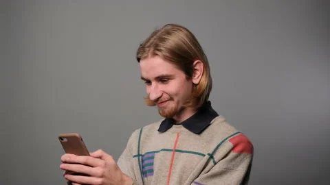 Man text messaging using mobile phone Stock Footage 229137912