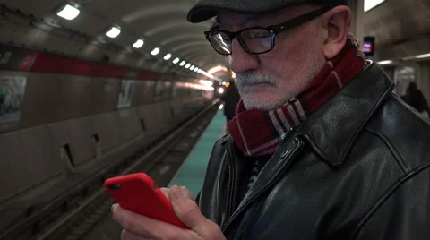 Man text messaging while waiting for subway train Stock Footage 48711318