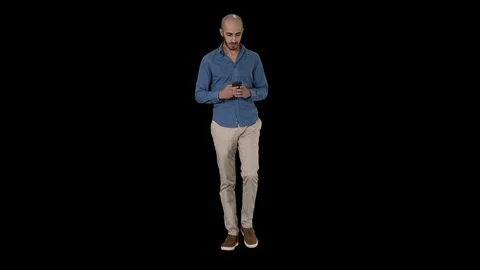 Man text messaging while walking, Alpha Channel Stock-Footage 109062466