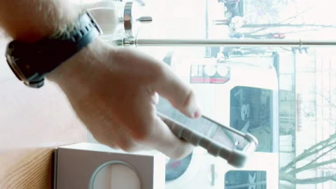 Man texting and browsing with mobile app in a cafe Stock Footage 91165004