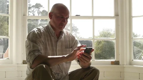 Man Texting and Scrolling on Cell Phone Video stock 75893022