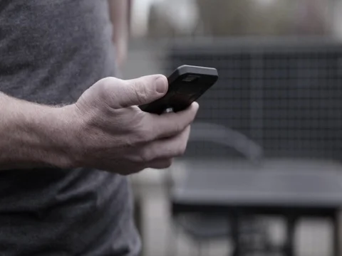 Man Texting in the City Video stock 77196314