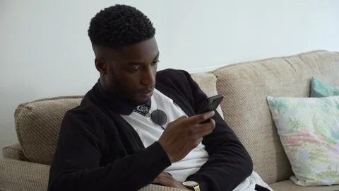 Man Texting on Couch on Phone Video stock 89922959