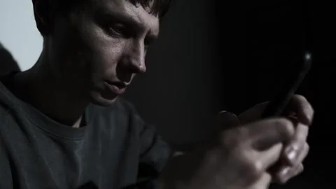 Man texting during relationship conflict, intense digital argument in the dark Stock Footage 320786116