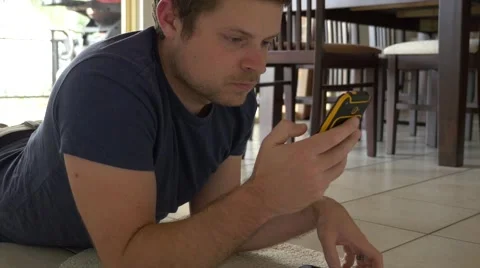 Man Texting From Floor 库存影片 40290783