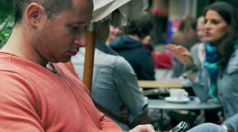 Man texting message on cellphone in the cafe, steadycam shot Stock Footage 43122358