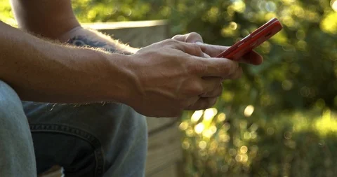 Man texting on phone upright then sideways. 4k 60 fps Stock Footage 111687330
