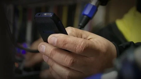 Man Texting on Retro Cell Phone in Radio Studio - Close Up 動画素材 86021155