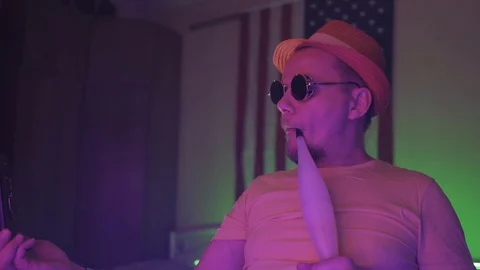 Man texting on the smartphone while smoking hookah. Stock Footage 130042952