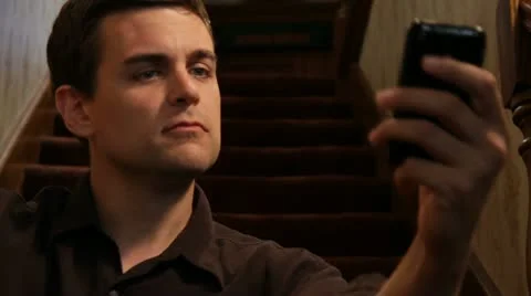 Man texting, then talking &amp; hangs up on iPhone Stock Footage 11894701