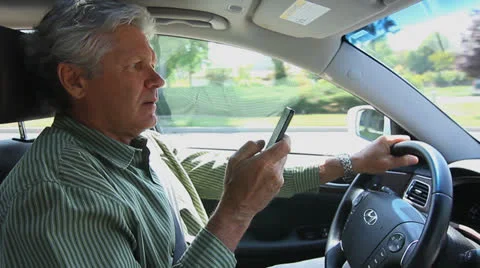 MAN TEXTING WHILE DRIVING Stock Footage