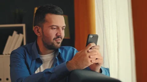 Man Texts Message by Window Stock Footage 167538837