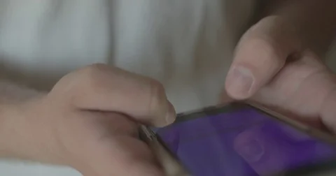 Man texts on smartphone at home Stock Footage 78037972