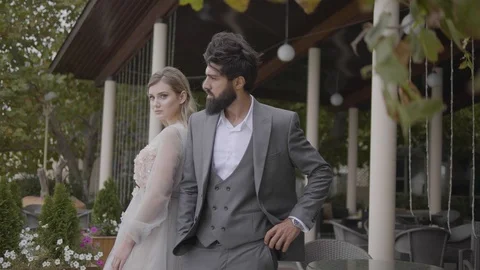 Man with thick beard blond lady stand at park cafe terrace Stock Footage 103935360