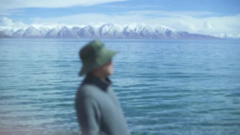 Man thinking about life by the lake Stock Footage 243064762
