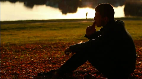 Man thinking about problems and smokes a cigarette Video stock 33008063
