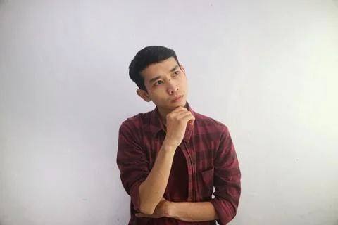 A man thinking about something while looking to his upper left corner Stock Photos