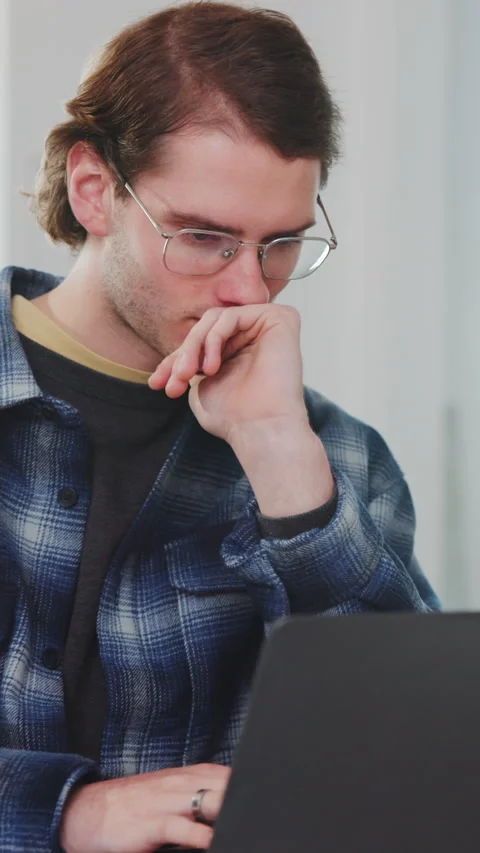 Man, thinking and browsing in office with laptop, glasses and download AI Stock Footage 343820413