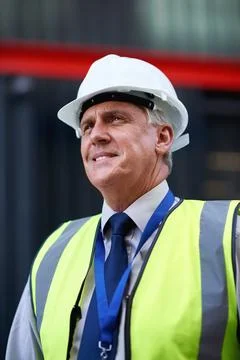 Man, thinking and construction with smile in city, foreman or supervisor with Stock Photos