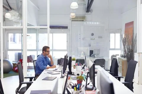 Man, thinking and data analysis in creative office with computer, marketing.. Stock Photos