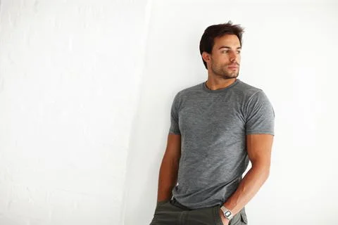 Man, thinking and decision at startup, office and problem solving by wall with Foto stock