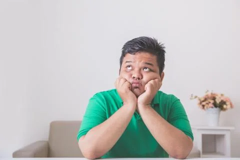 Man thinking and looking up to copyspace Stock Photos