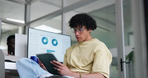 Man, thinking and reading in office with tablet, data analysis or research for Stock Footage 329399975