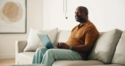 Man, thinking and remote work in living room with laptop, idea or typing Stock Footage 337756561