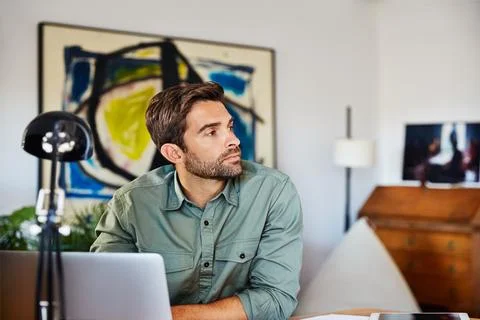 Man, thinking and remote work with laptop in home office, ideas and plannin.. Stock Photos