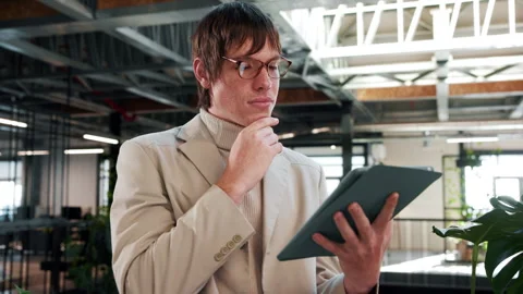 Man, thinking and research in office with tablet, sustainability regulations or Stock Footage 338007524