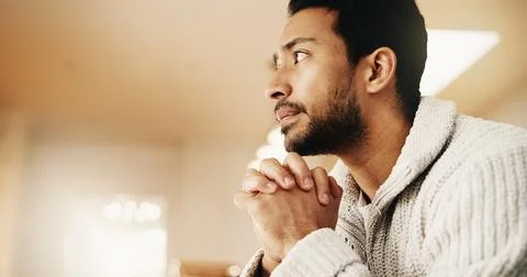 Man, thinking and waiting with doubt in home for mental health, trauma or f.. Stock Photos