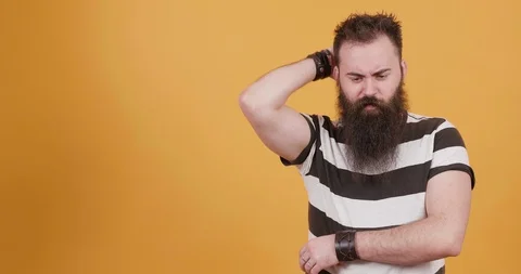 Man thinking of an idea and a bulb lights up when he gets one Stock Footage 104082629