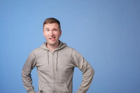 Man thinking over blue background Stock Photos