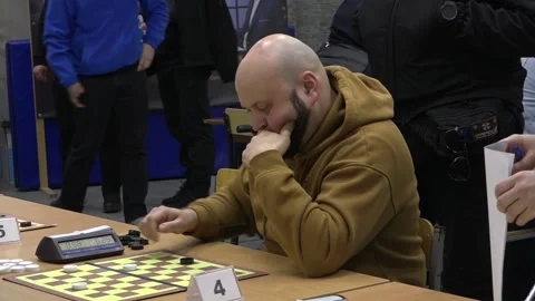 Man Thinking Over Checkers Move. Medium Shot Stock Footage 332161883
