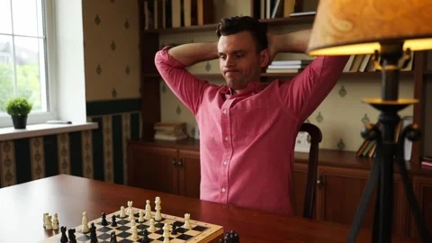 Man Thinking Over Chess Move at Home Stock Footage 332639794