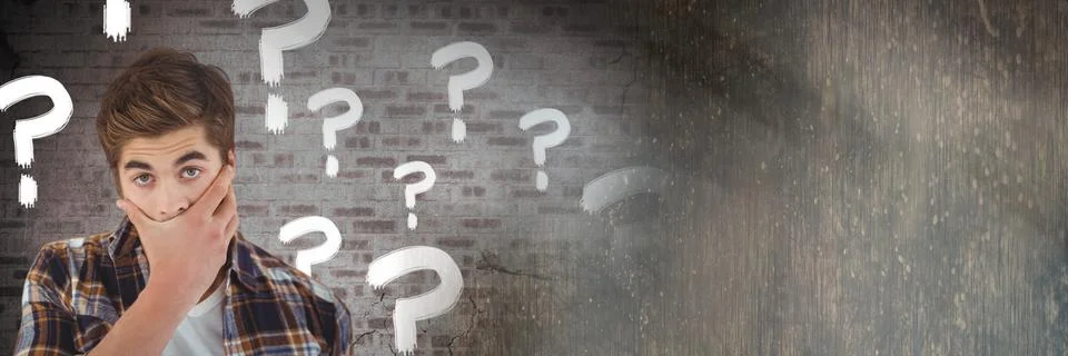 Man thinking with question marks and cracked old wall Stock Photos