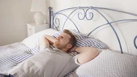 Man Thinking Reflective Thoughtful Resting Relaxing Sleeping Bed Day Time Vídeo Stock 195288409