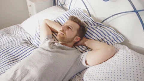 Man Thinking Reflective Thoughtful Resting Relaxing Sleeping Bed Day Time Stock-Footage 195288413