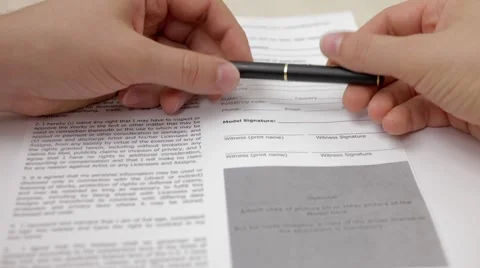 A man thinking before signing document Stock Footage 54354645