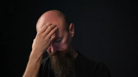 Man thinking skratching his forehead looking down Stock Footage 35736397