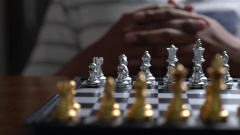 Man thinking strategy and moving chess pawn defeat enemy on chessboard Stock Footage 106799611
