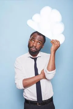 Man thinking under thought bubble Stock Photos