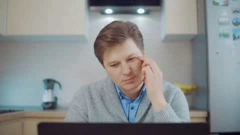 Man thinking while sitting at the computer Stock Footage 148342253