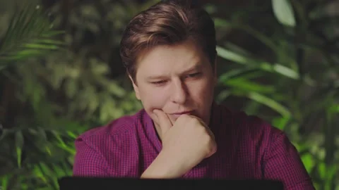 Man thinking while sitting at the computer Stock Footage 150157793