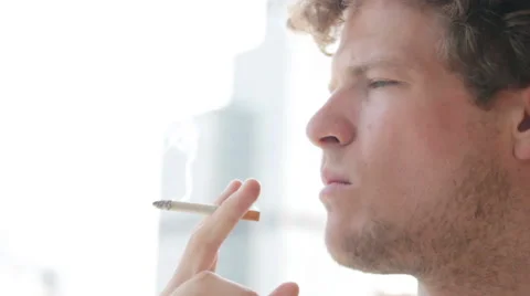 Man thinking while smoking Stock Footage 40626740