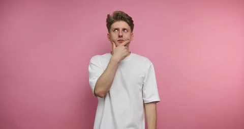 Man thinks and gestures in front of pink background in four frames showing .. Stockbeeldmateriaal 331990936
