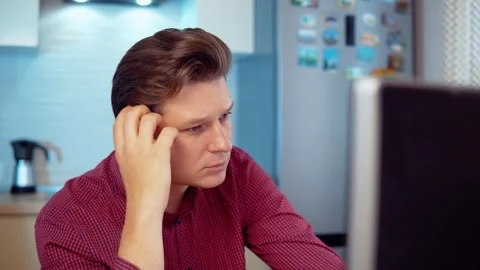 A man thinks at home at the computer Stock Footage 144991328