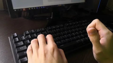 The man thinks what to type on the keyboard. Sitting at home at the computer Stock Footage 160554743