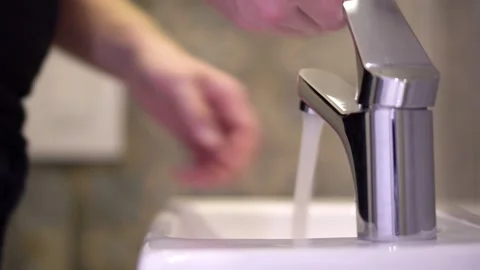 Man thoroughly washes his hands to prevent infection with the virus Stock Footage 126673754