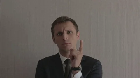 The man is threatening with his finger Stock Footage 78225470